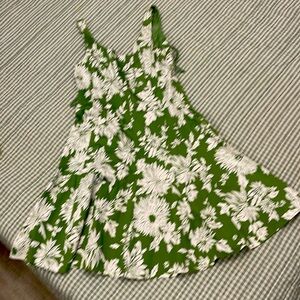 Sleeveless dress, Size 12. Motion and gores, to flare out. Green w/white floral